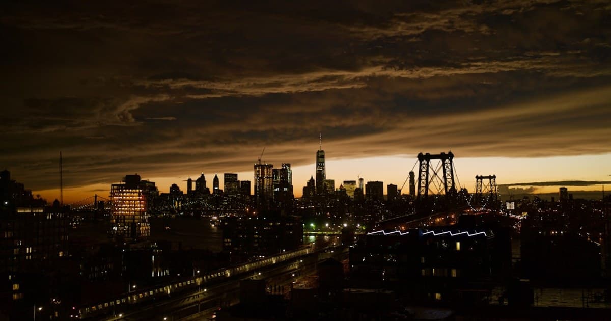 Seen from the roof of my building in Brookyln. I loved the ribbon of light that ran across the skyline.
