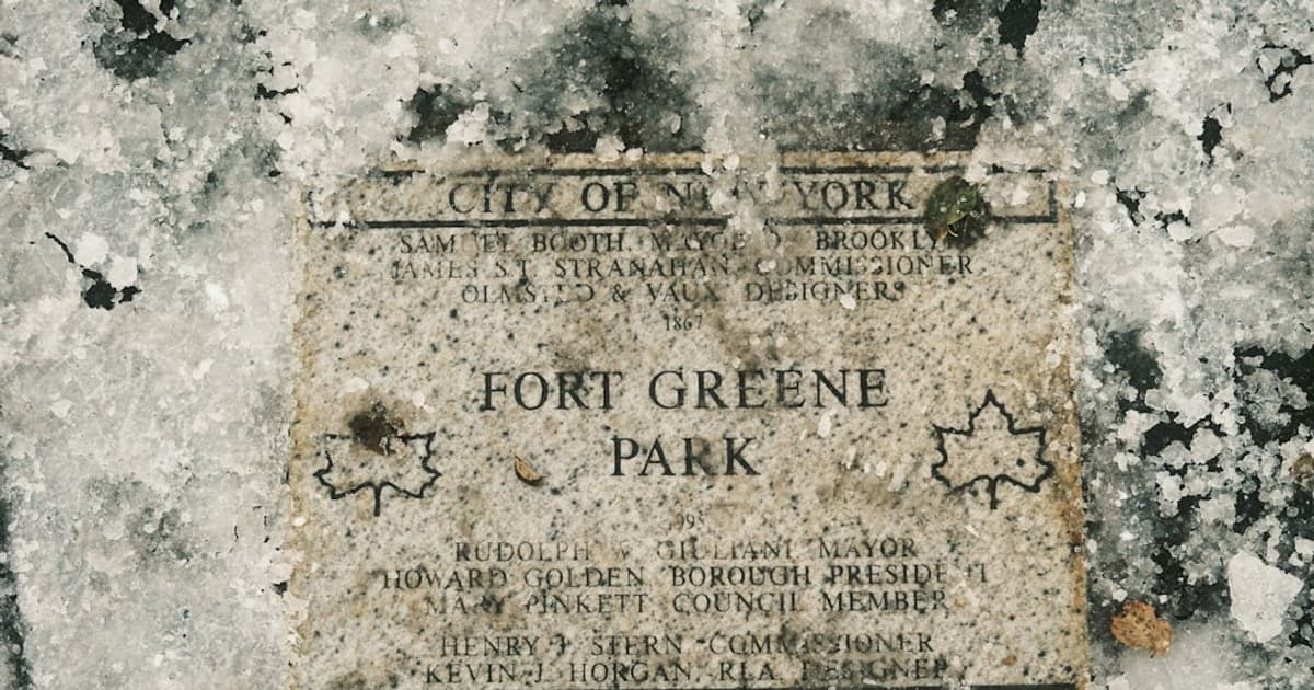 Fort greene park sign covered in snow