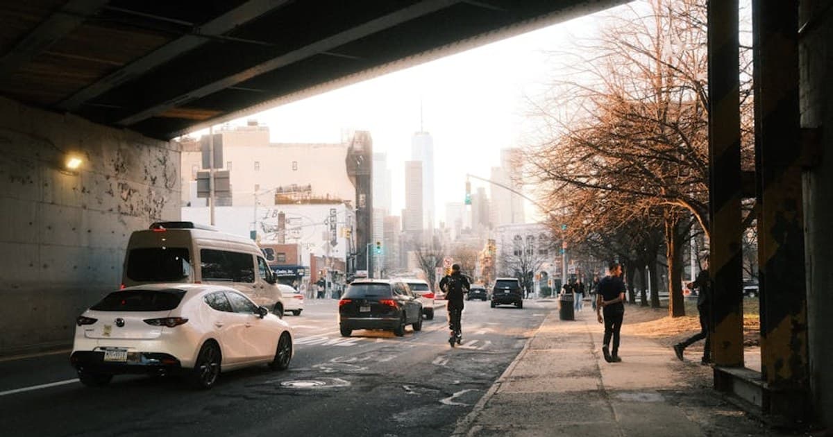 A lively Brooklyn street scene with a view of the NYC skyline, showcasing everyday urban life.