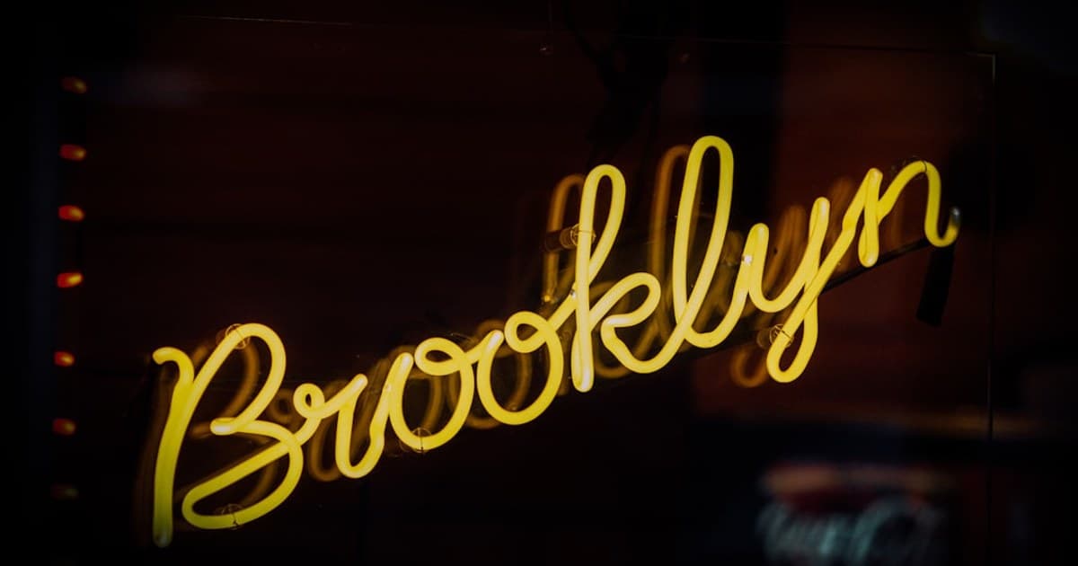 a neon sign that says brooklyn on it