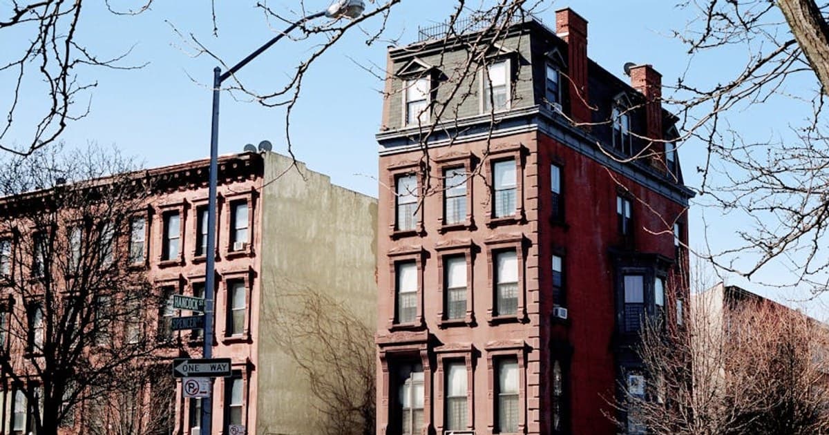 A daylight view of historic brownstone architecture on Hancock Street, Brooklyn, NYC.